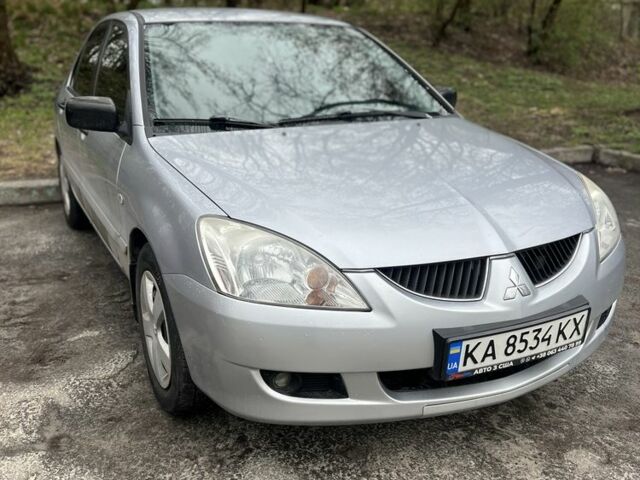 Серый Мицубиси Лансер Эволюшн, объемом двигателя 1.6 л и пробегом 210 тыс. км за 4300 $, фото 1 на Automoto.ua