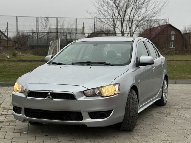 Серый Мицубиси Лансер Эволюшн, объемом двигателя 2 л и пробегом 300 тыс. км за 3500 $, фото 1 на Automoto.ua