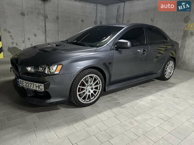 Серый Мицубиси Лансер Эволюшн, объемом двигателя 2 л и пробегом 150 тыс. км за 18500 $, фото 1 на Automoto.ua