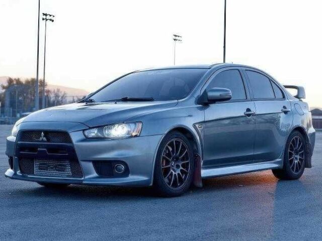 Сірий Міцубісі Лансер Еволюшн, об'ємом двигуна 2 л та пробігом 99 тис. км за 9100 $, фото 1 на Automoto.ua