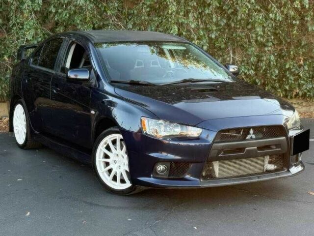 Синий Мицубиси Лансер Эволюшн, объемом двигателя 2 л и пробегом 144 тыс. км за 11000 $, фото 1 на Automoto.ua