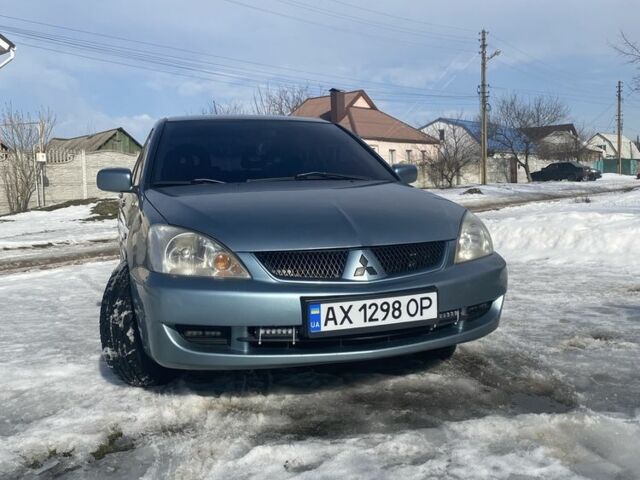 Зелений Міцубісі Лансер Еволюшн, об'ємом двигуна 1.6 л та пробігом 221 тис. км за 3350 $, фото 1 на Automoto.ua