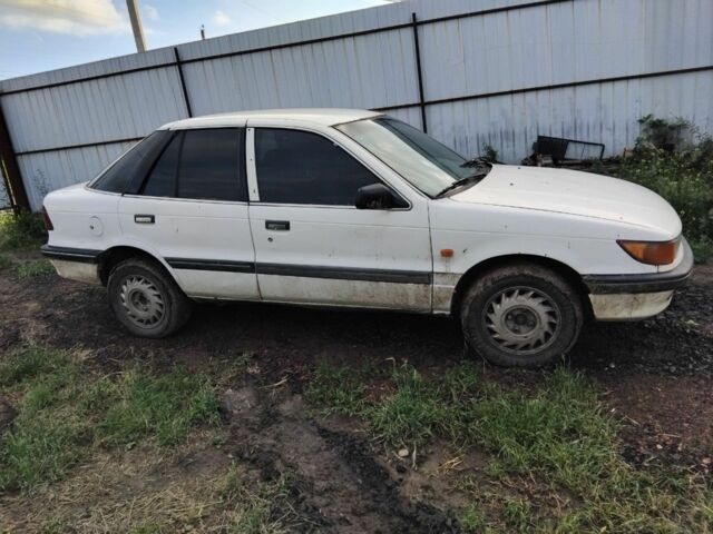 Белый Мицубиси Лансер, объемом двигателя 1.8 л и пробегом 86 тыс. км за 700 $, фото 1 на Automoto.ua