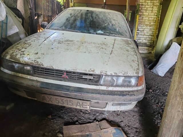 Білий Міцубісі Lancer, об'ємом двигуна 1.8 л та пробігом 250 тис. км за 894 $, фото 1 на Automoto.ua