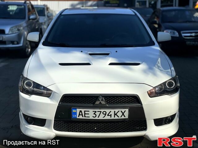 Белый Мицубиси Лансер, объемом двигателя 1.8 л и пробегом 185 тыс. км за 8500 $, фото 1 на Automoto.ua