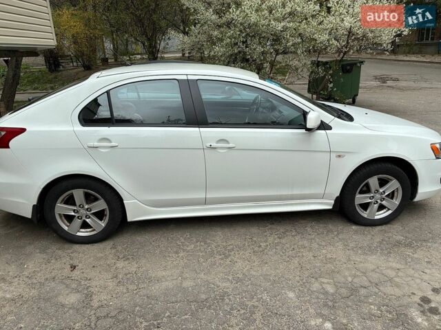 Білий Міцубісі Lancer, об'ємом двигуна 1.8 л та пробігом 147 тис. км за 7070 $, фото 1 на Automoto.ua