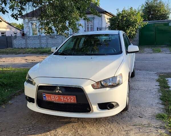 Белый Мицубиси Лансер, объемом двигателя 1.5 л и пробегом 154 тыс. км за 8700 $, фото 1 на Automoto.ua