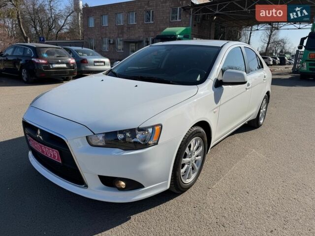 Білий Міцубісі Lancer, об'ємом двигуна 1.8 л та пробігом 154 тис. км за 9750 $, фото 1 на Automoto.ua