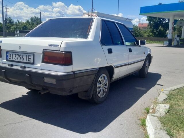 Білий Міцубісі Lancer, об'ємом двигуна 1.5 л та пробігом 292 тис. км за 1216 $, фото 1 на Automoto.ua