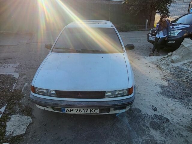 Белый Мицубиси Лансер, объемом двигателя 1.5 л и пробегом 300 тыс. км за 1300 $, фото 1 на Automoto.ua