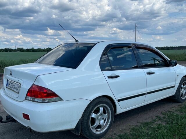Білий Міцубісі Lancer, об'ємом двигуна 1.6 л та пробігом 198 тис. км за 4463 $, фото 1 на Automoto.ua