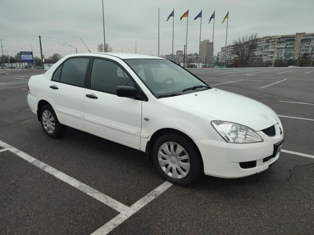 Белый Мицубиси Лансер, объемом двигателя 1.6 л и пробегом 306 тыс. км за 3000 $, фото 1 на Automoto.ua