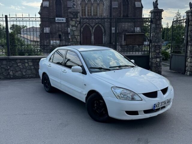 Белый Мицубиси Лансер, объемом двигателя 1.6 л и пробегом 5 тыс. км за 3499 $, фото 1 на Automoto.ua