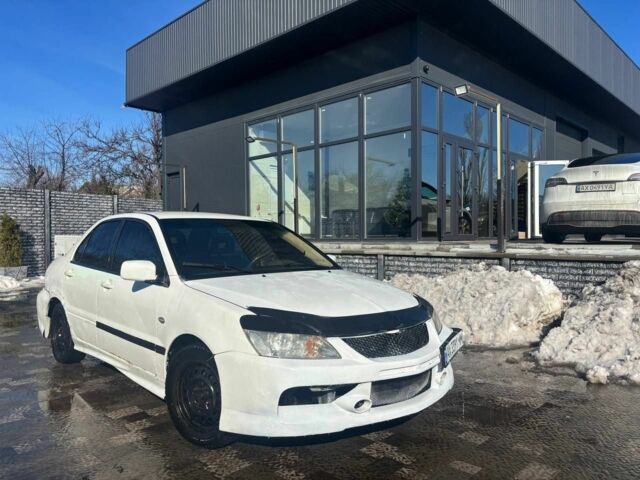 Білий Міцубісі Lancer, об'ємом двигуна 1.6 л та пробігом 200 тис. км за 2925 $, фото 1 на Automoto.ua