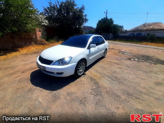 Білий Міцубісі Lancer, об'ємом двигуна 1.6 л та пробігом 296 тис. км за 3500 $, фото 1 на Automoto.ua