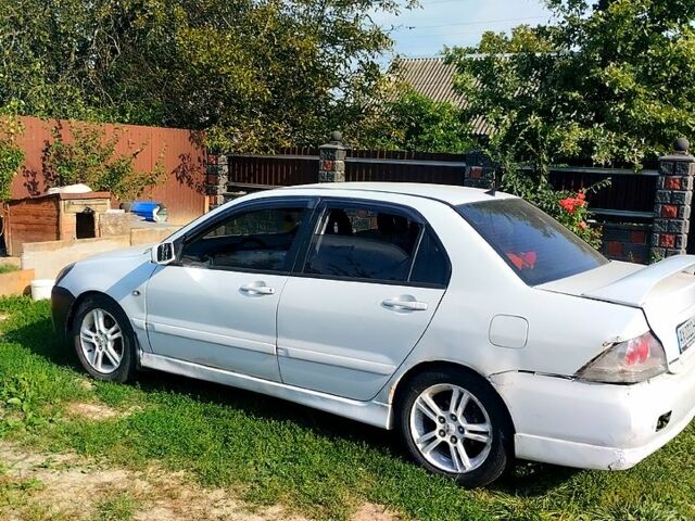 Білий Міцубісі Lancer, об'ємом двигуна 2 л та пробігом 200 тис. км за 1950 $, фото 1 на Automoto.ua
