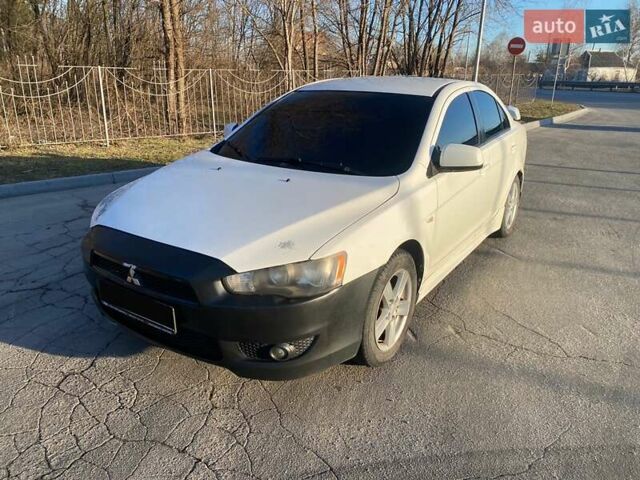 Белый Мицубиси Лансер, объемом двигателя 2 л и пробегом 328 тыс. км за 5200 $, фото 1 на Automoto.ua