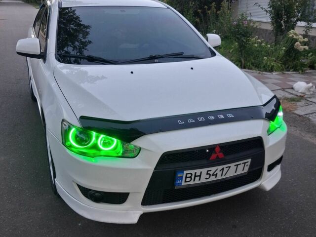 Белый Мицубиси Лансер, объемом двигателя 2 л и пробегом 180 тыс. км за 6752 $, фото 1 на Automoto.ua
