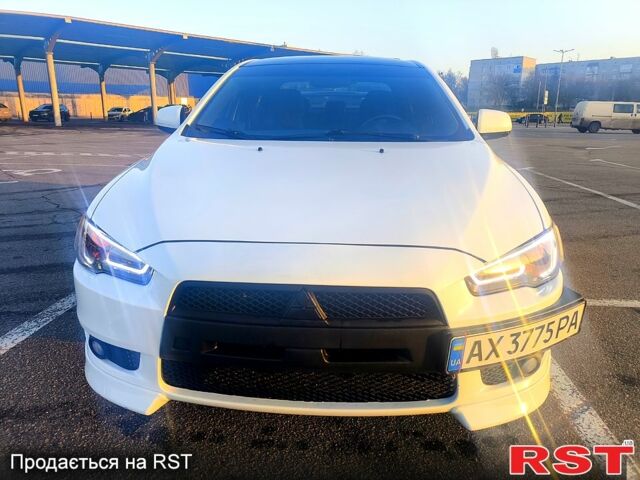 Білий Міцубісі Lancer, об'ємом двигуна 2 л та пробігом 172 тис. км за 7350 $, фото 1 на Automoto.ua