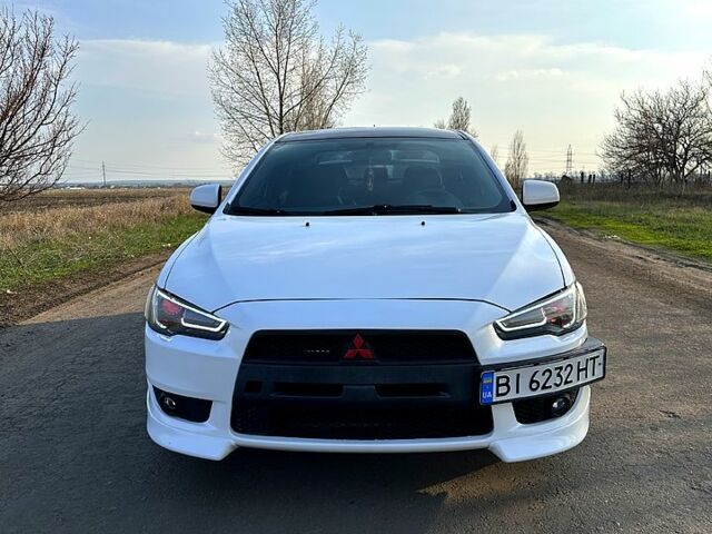 Білий Міцубісі Lancer, об'ємом двигуна 2 л та пробігом 165 тис. км за 5800 $, фото 1 на Automoto.ua