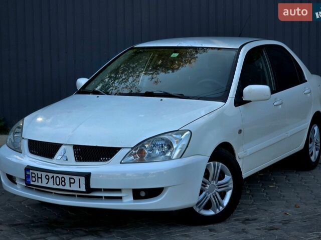 Білий Міцубісі Lancer, об'ємом двигуна 1.58 л та пробігом 217 тис. км за 3299 $, фото 1 на Automoto.ua