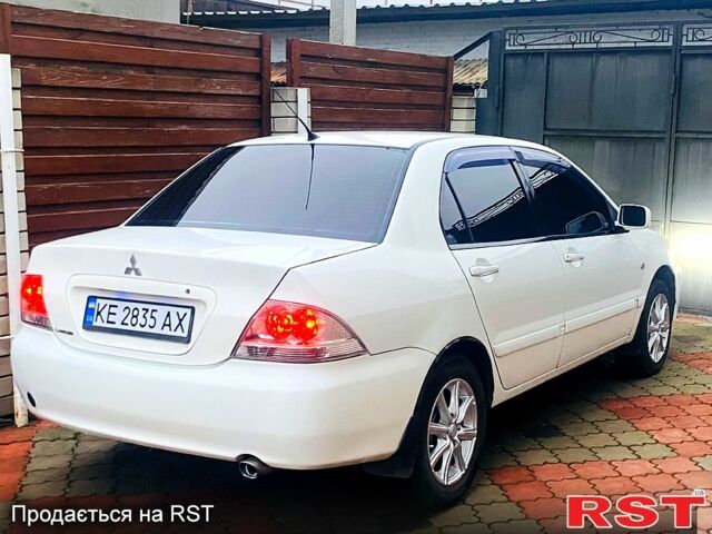Белый Мицубиси Лансер, объемом двигателя 1.6 л и пробегом 220 тыс. км за 3850 $, фото 1 на Automoto.ua