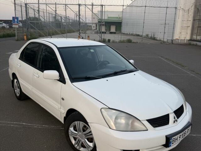 Білий Міцубісі Lancer, об'ємом двигуна 1.6 л та пробігом 213 тис. км за 3204 $, фото 1 на Automoto.ua