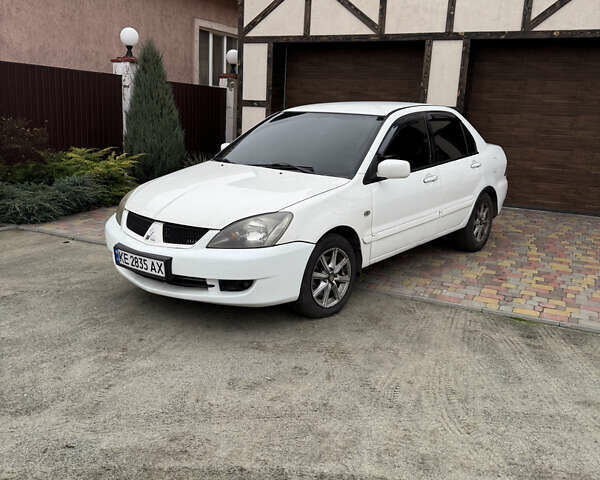 Белый Мицубиси Лансер, объемом двигателя 1.58 л и пробегом 285 тыс. км за 3500 $, фото 1 на Automoto.ua