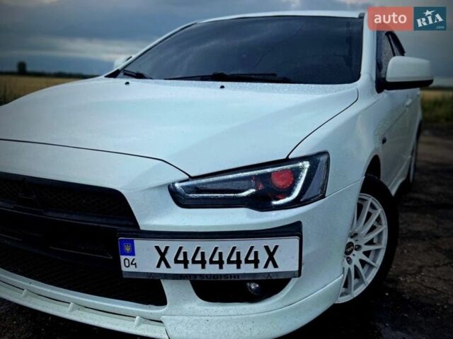 Белый Мицубиси Лансер, объемом двигателя 2 л и пробегом 188 тыс. км за 7800 $, фото 1 на Automoto.ua