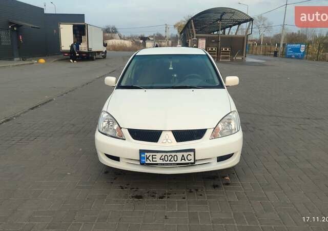 Білий Міцубісі Lancer, об'ємом двигуна 1.58 л та пробігом 250 тис. км за 4400 $, фото 1 на Automoto.ua