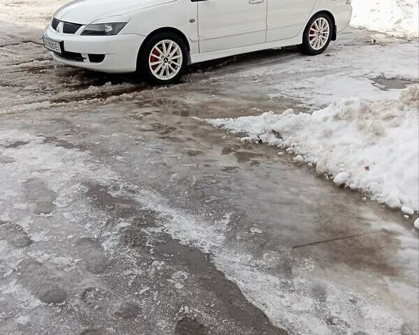 Білий Міцубісі Lancer, об'ємом двигуна 1.59 л та пробігом 221 тис. км за 5250 $, фото 1 на Automoto.ua