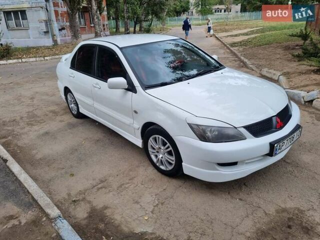 Білий Міцубісі Lancer, об'ємом двигуна 1.6 л та пробігом 213 тис. км за 4000 $, фото 1 на Automoto.ua