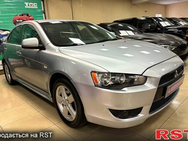 Белый Мицубиси Лансер, объемом двигателя 2 л и пробегом 172 тыс. км за 6300 $, фото 1 на Automoto.ua