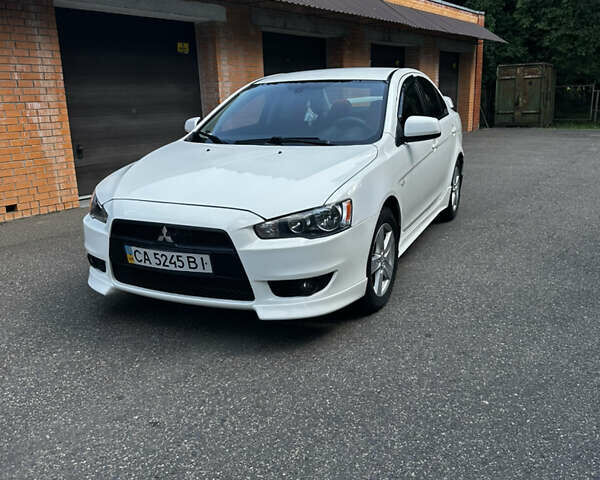 Білий Міцубісі Lancer, об'ємом двигуна 2 л та пробігом 121 тис. км за 8000 $, фото 1 на Automoto.ua