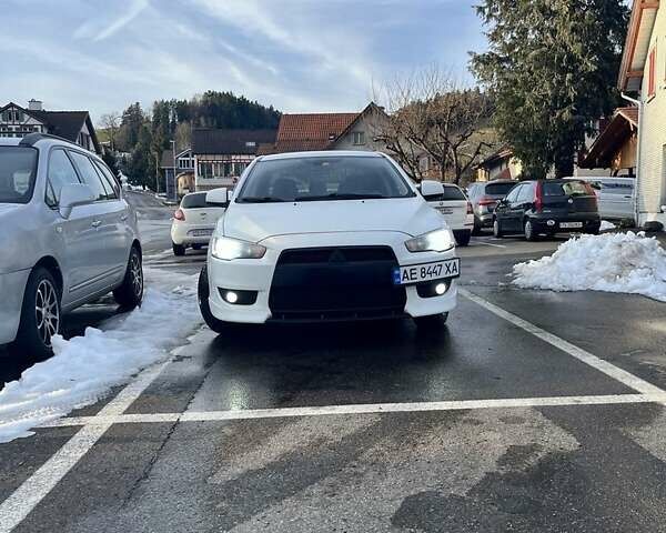 Белый Мицубиси Лансер, объемом двигателя 2 л и пробегом 256 тыс. км за 4900 $, фото 1 на Automoto.ua