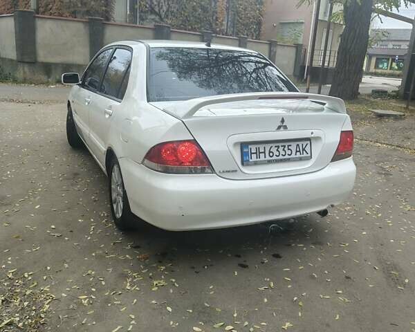 Белый Мицубиси Лансер, объемом двигателя 1.59 л и пробегом 222 тыс. км за 4950 $, фото 1 на Automoto.ua
