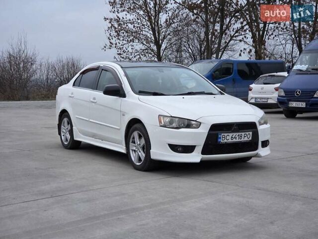 Белый Мицубиси Лансер, объемом двигателя 2 л и пробегом 218 тыс. км за 5555 $, фото 1 на Automoto.ua