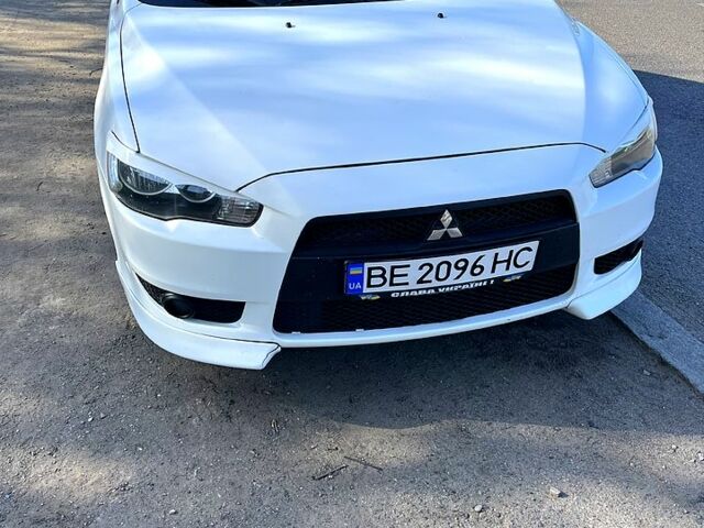 Белый Мицубиси Лансер, объемом двигателя 2 л и пробегом 230 тыс. км за 6700 $, фото 1 на Automoto.ua