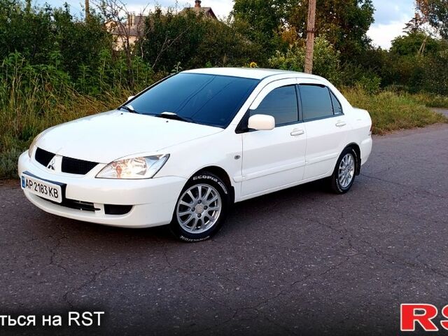 Білий Міцубісі Lancer, об'ємом двигуна 1.6 л та пробігом 237 тис. км за 6000 $, фото 1 на Automoto.ua