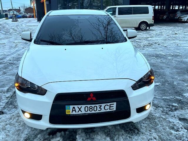 Білий Міцубісі Lancer, об'ємом двигуна 2 л та пробігом 185 тис. км за 7600 $, фото 1 на Automoto.ua