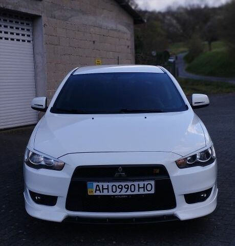 Білий Міцубісі Lancer, об'ємом двигуна 2 л та пробігом 150 тис. км за 8271 $, фото 1 на Automoto.ua