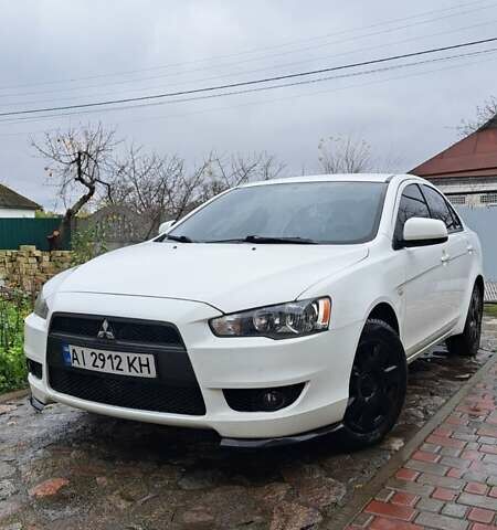 Белый Мицубиси Лансер, объемом двигателя 1.5 л и пробегом 160 тыс. км за 7600 $, фото 1 на Automoto.ua