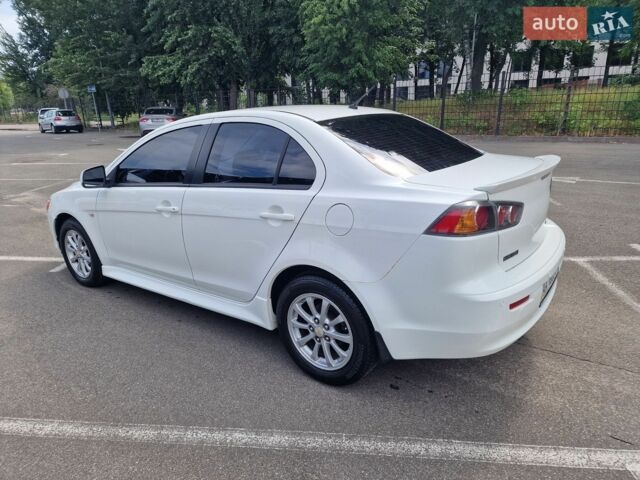 Білий Міцубісі Lancer, об'ємом двигуна 2 л та пробігом 208 тис. км за 6500 $, фото 1 на Automoto.ua