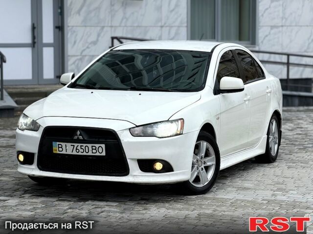 Белый Мицубиси Лансер, объемом двигателя 1.8 л и пробегом 185 тыс. км за 5999 $, фото 1 на Automoto.ua