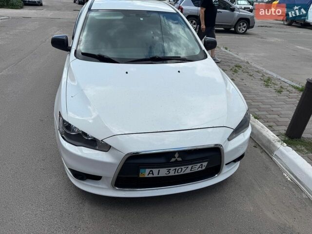 Белый Мицубиси Лансер, объемом двигателя 1.6 л и пробегом 165 тыс. км за 6500 $, фото 1 на Automoto.ua