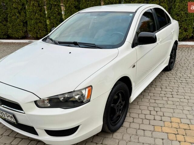Білий Міцубісі Lancer, об'ємом двигуна 2 л та пробігом 238 тис. км за 7899 $, фото 1 на Automoto.ua