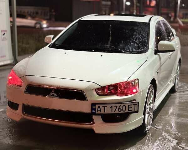 Белый Мицубиси Лансер, объемом двигателя 2 л и пробегом 210 тыс. км за 9700 $, фото 1 на Automoto.ua