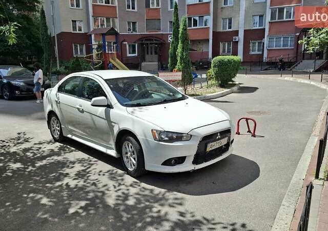 Белый Мицубиси Лансер, объемом двигателя 1.6 л и пробегом 163 тыс. км за 8000 $, фото 1 на Automoto.ua