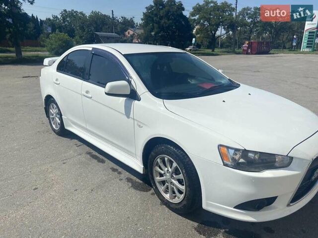 Белый Мицубиси Лансер, объемом двигателя 1.6 л и пробегом 238 тыс. км за 8500 $, фото 1 на Automoto.ua