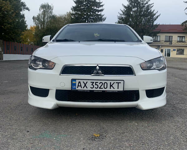 Білий Міцубісі Lancer, об'ємом двигуна 2 л та пробігом 132 тис. км за 9200 $, фото 1 на Automoto.ua